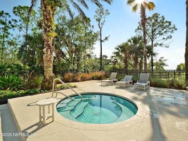 view of pool with a patio area and fence