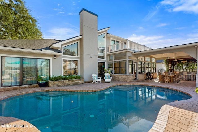 view of swimming pool with a patio area