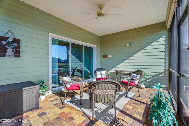 view of patio featuring an outdoor hangout area and ceiling fan