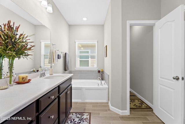 bathroom featuring vanity and a bathtub