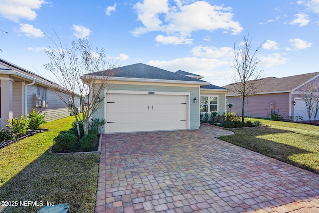 view of front of property with a garage and a front yard