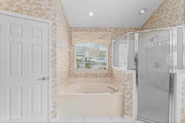 bathroom with tile patterned flooring and shower with separate bathtub