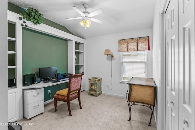 office with vaulted ceiling, ceiling fan, and light colored carpet