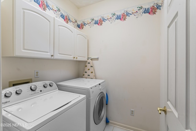 laundry room with cabinets and separate washer and dryer