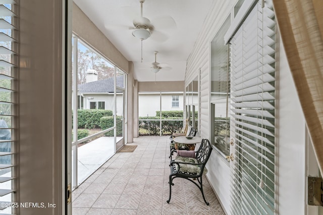 sunroom / solarium with ceiling fan