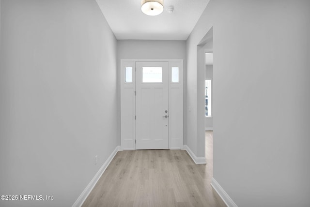 doorway to outside with light hardwood / wood-style floors