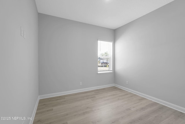 unfurnished room featuring light wood-type flooring