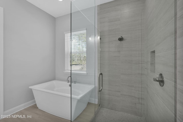 bathroom with independent shower and bath