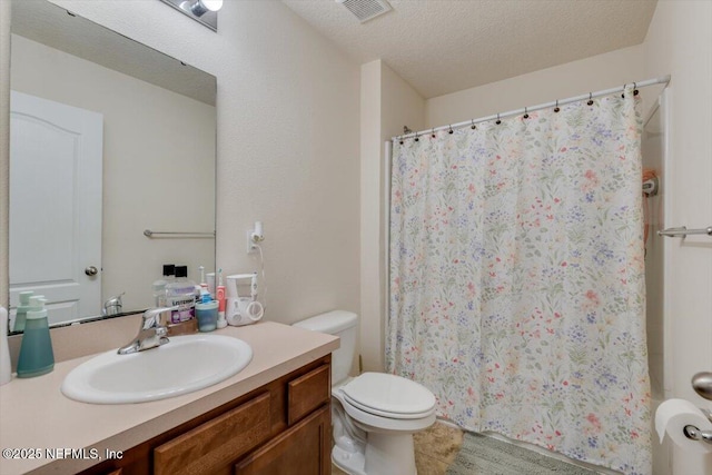 bathroom featuring tile patterned floors, toilet, a textured ceiling, vanity, and a shower with shower curtain