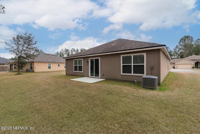 back of property featuring central AC, a patio, and a lawn