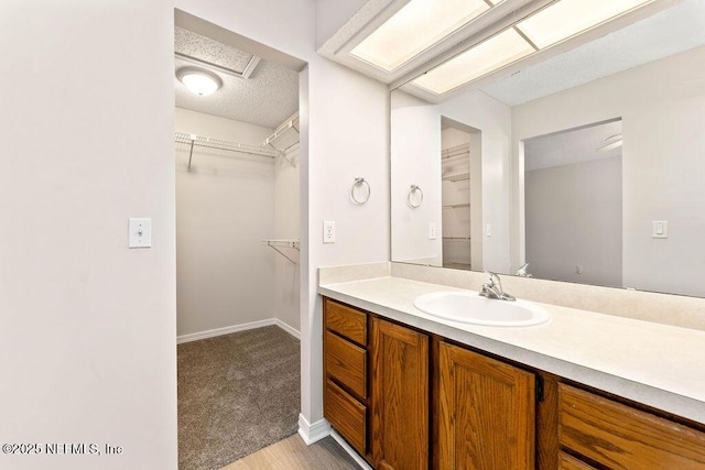 bathroom featuring vanity and a textured ceiling