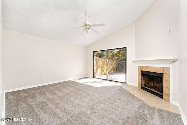 unfurnished living room with high vaulted ceiling, a fireplace, ceiling fan, light carpet, and a textured ceiling