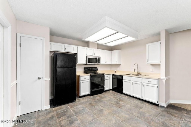 kitchen featuring white cabinetry, sink, and black appliances