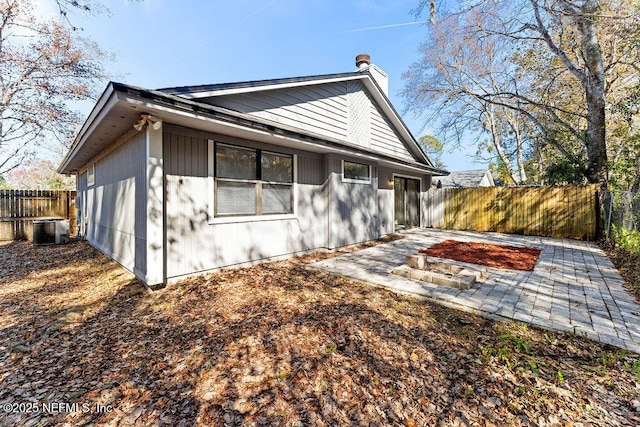 back of house with a patio and central AC unit