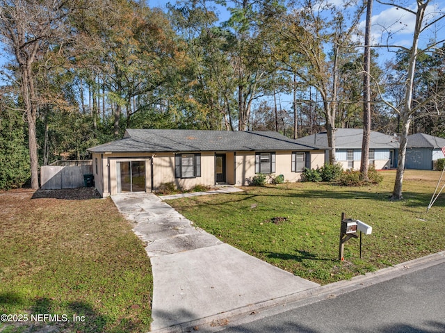 ranch-style home featuring a front yard