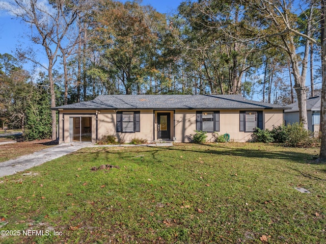 single story home with a garage and a front yard