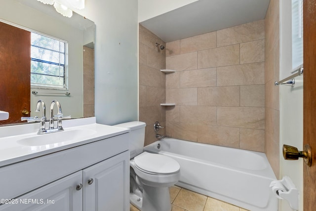 full bathroom with vanity, tiled shower / bath combo, tile patterned floors, and toilet