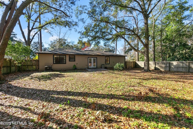 back of house featuring french doors and cooling unit