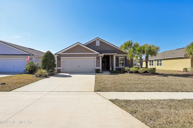 view of front facade featuring a garage and a front yard