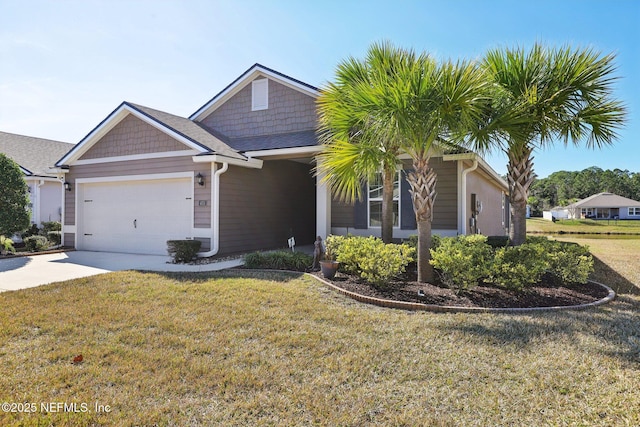 view of front facade featuring a garage and a front lawn