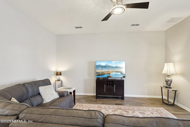 living room with hardwood / wood-style floors and ceiling fan