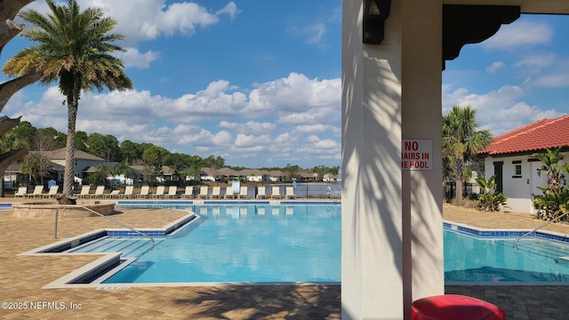 view of swimming pool featuring a patio