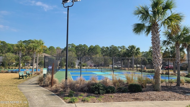 view of pool with tennis court