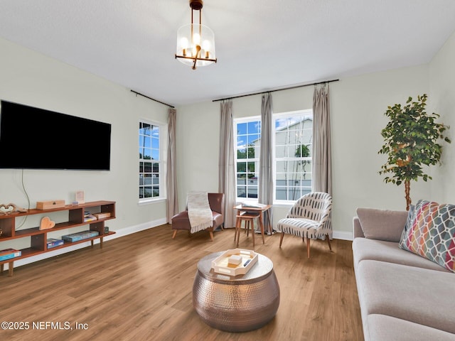 living room featuring hardwood / wood-style floors and a chandelier