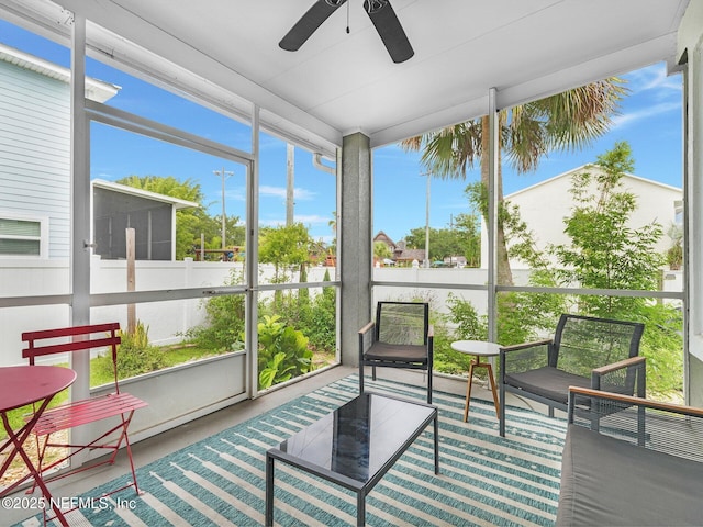 sunroom featuring ceiling fan