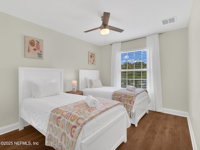 bedroom featuring dark hardwood / wood-style floors and ceiling fan