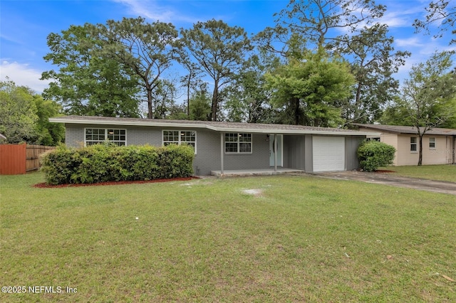 ranch-style house with a garage and a front lawn