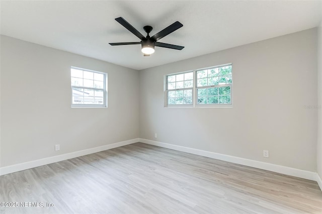 unfurnished room featuring ceiling fan and light wood-type flooring