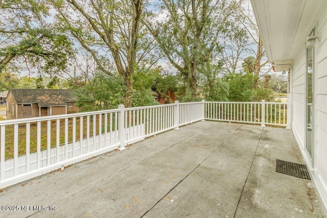 view of patio with an outdoor structure