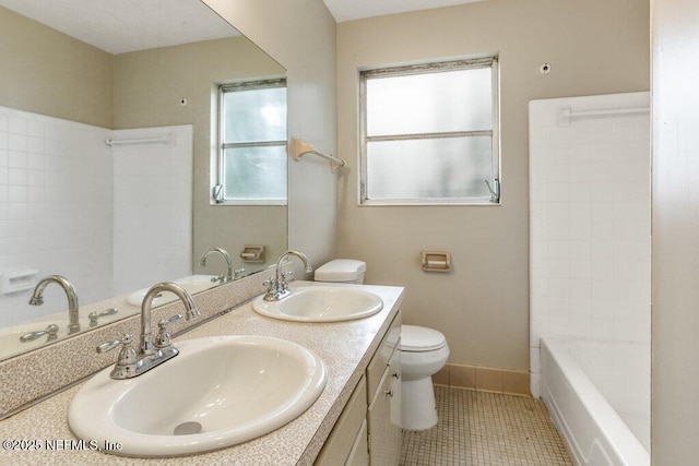 full bathroom featuring tile patterned flooring, vanity, toilet, and shower / bath combination