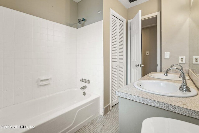 bathroom with vanity, tile patterned floors, and washtub / shower combination