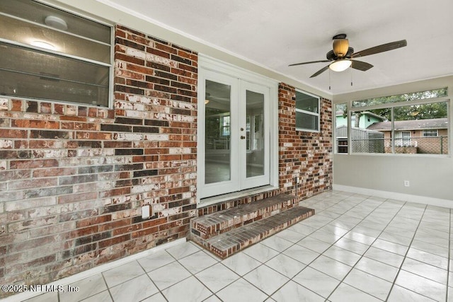 exterior space featuring french doors and ceiling fan