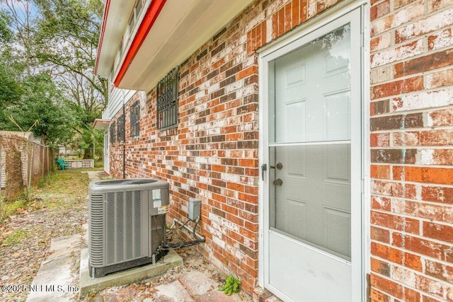 entrance to property featuring central AC