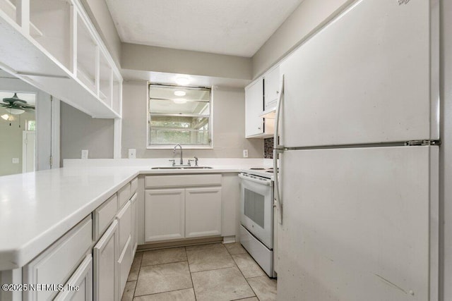 kitchen with white cabinetry, white appliances, ceiling fan, and sink