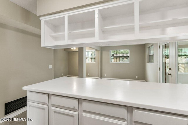 kitchen featuring white cabinets