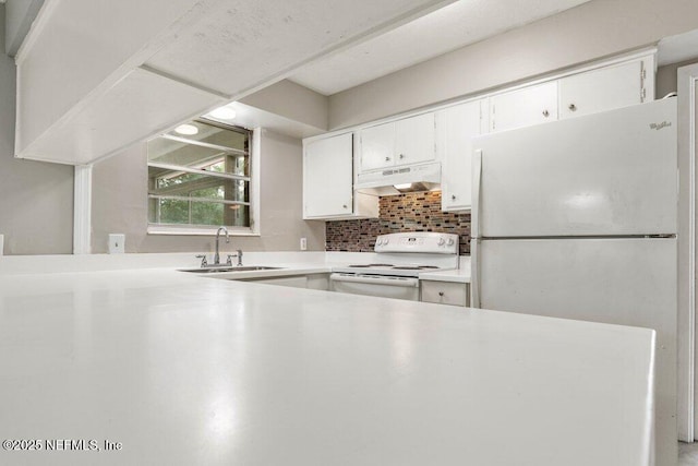 kitchen with white cabinetry, sink, white appliances, and tasteful backsplash