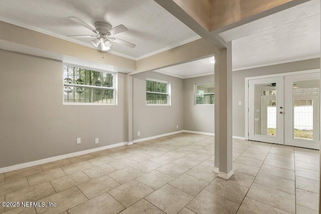 interior space with ornamental molding, french doors, and ceiling fan