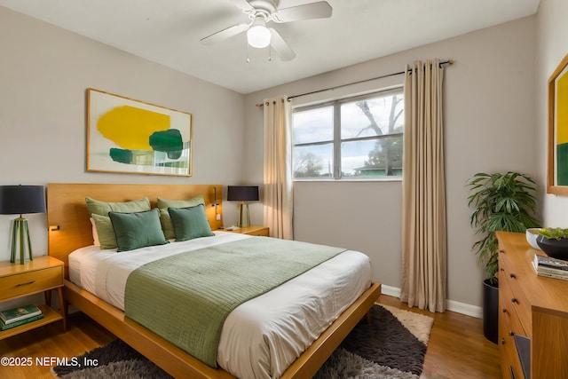 bedroom with hardwood / wood-style flooring and ceiling fan