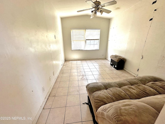 tiled living room with ceiling fan and lofted ceiling