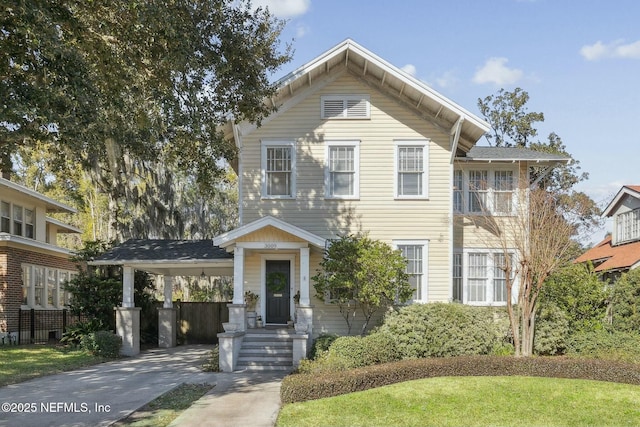 view of front of property featuring a carport