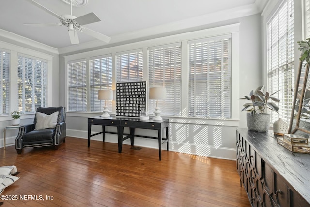 interior space with dark wood-type flooring, ceiling fan, and a healthy amount of sunlight