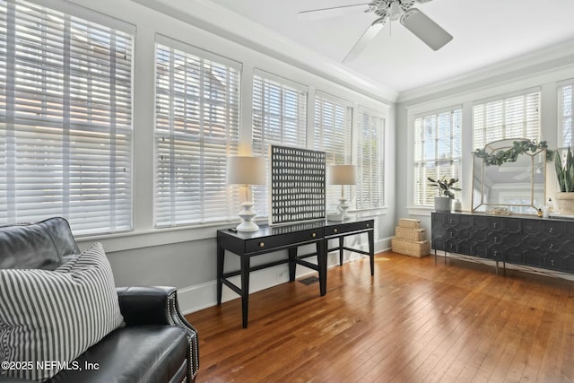 sunroom / solarium featuring ceiling fan and a wealth of natural light