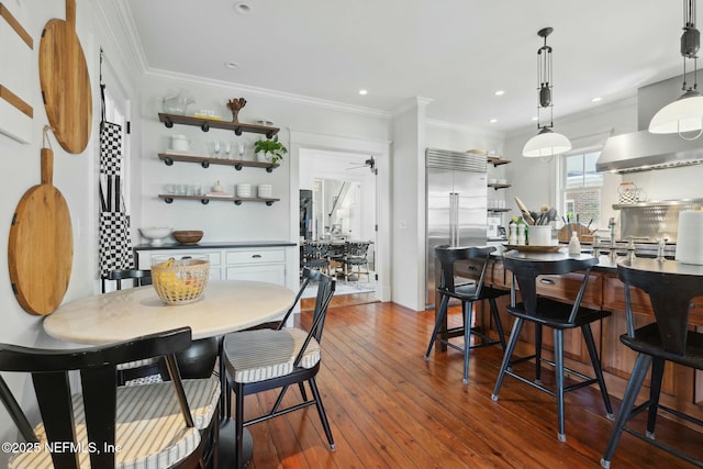 interior space with crown molding, wood-type flooring, and ceiling fan