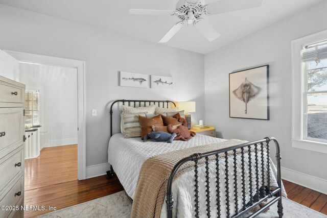 bedroom featuring light hardwood / wood-style floors and ceiling fan