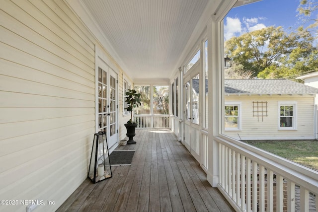 wooden terrace featuring a porch