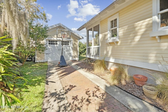 view of home's exterior with an outbuilding and a garage